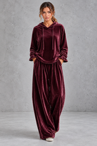 Women's burgundy velvet hoodie and wide leg trouser set – front view