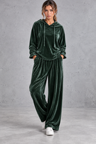 Women's dark green velvet hoodie and wide leg trouser set – front view