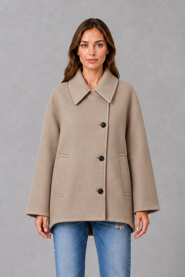 Women’s vintage casual longline coat with a relaxed silhouette, practical front pockets and timeless retro-inspired styling for cooler weather.