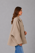 Women’s vintage casual longline coat with a relaxed silhouette, practical front pockets and timeless retro-inspired styling for cooler weather.