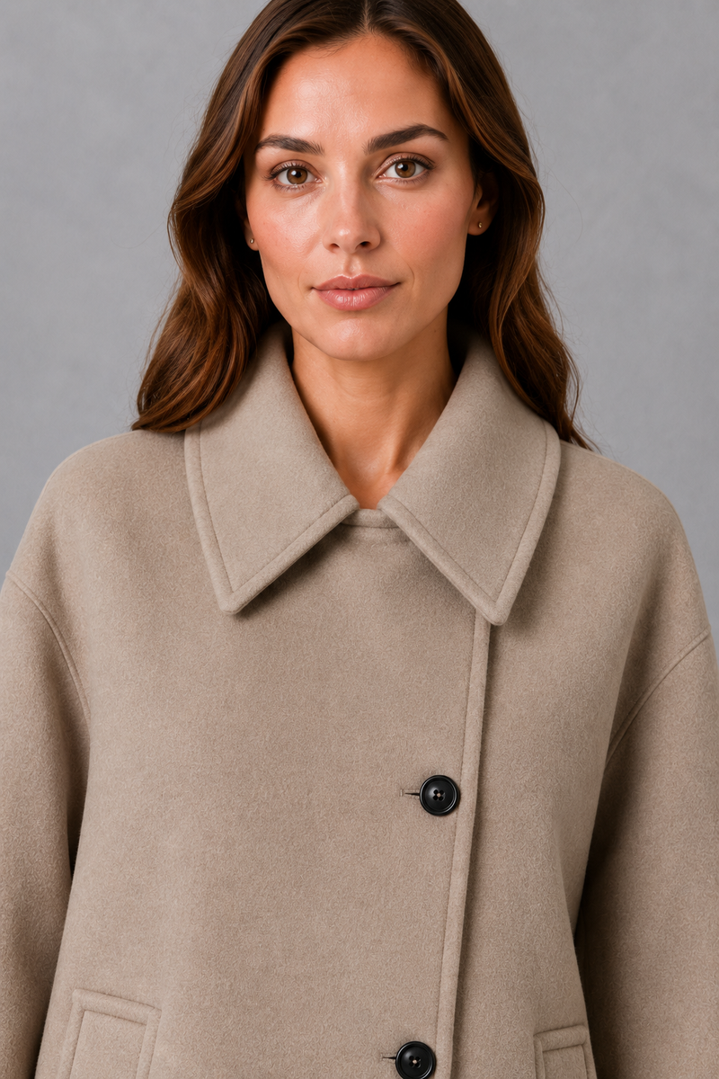 Women’s vintage casual longline coat with a relaxed silhouette, practical front pockets and timeless retro-inspired styling for cooler weather.