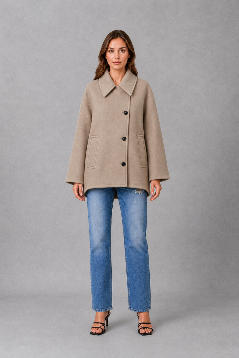 Women’s vintage casual longline coat with a relaxed silhouette, practical front pockets and timeless retro-inspired styling for cooler weather.