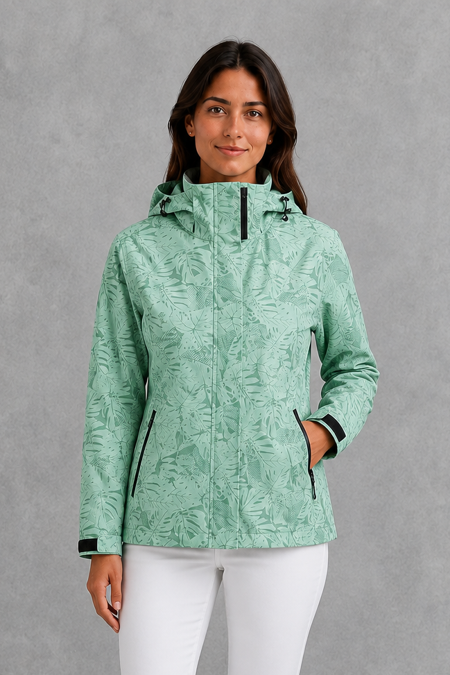 Women’s waterproof leaf print jacket with a protective hood, adjustable drawstring waist and lightweight design for rainy and changeable weather.