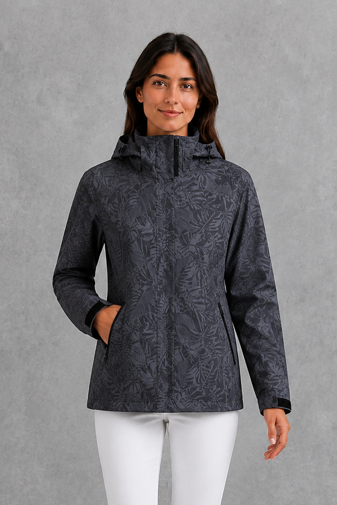 Women’s waterproof leaf print jacket with a protective hood, adjustable drawstring waist and lightweight design for rainy and changeable weather.