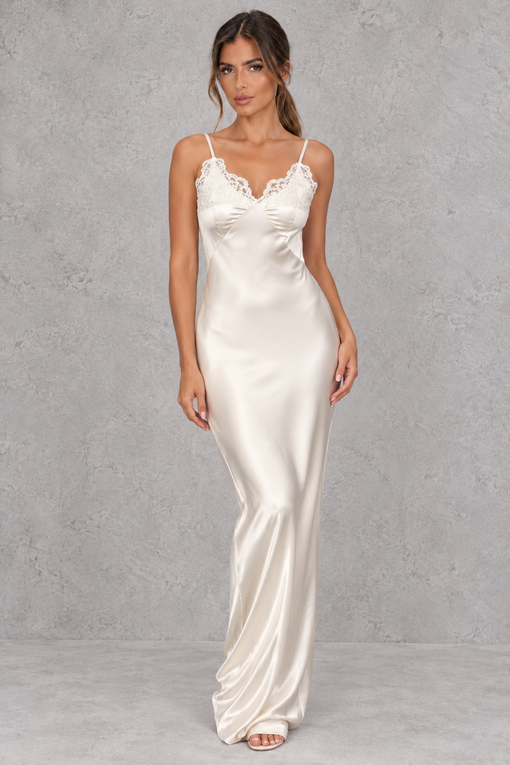 Women’s white satin-look lace maxi dress with V-neckline, slender shoulder straps, delicate lace patchwork and statement backless design.