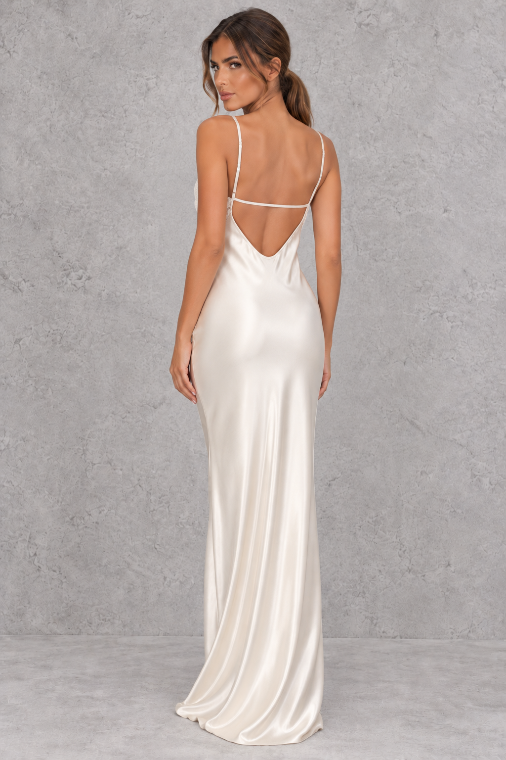Women’s white satin-look lace maxi dress with V-neckline, slender shoulder straps, delicate lace patchwork and statement backless design.