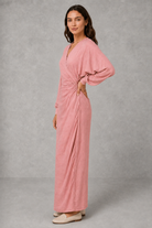 Women’s wrap maxi dress with a V-neckline, ruched side waist, long cuffed sleeves, flowing full-length skirt and subtle side slit.