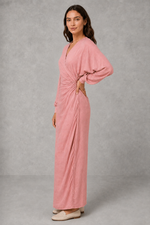 Women’s wrap maxi dress with a V-neckline, ruched side waist, long cuffed sleeves, flowing full-length skirt and subtle side slit.
