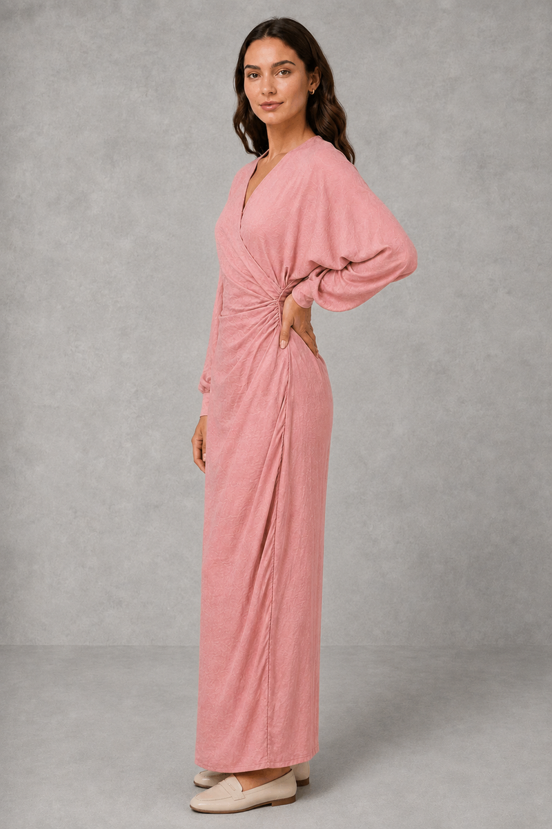 Women’s wrap maxi dress with a V-neckline, ruched side waist, long cuffed sleeves, flowing full-length skirt and subtle side slit.