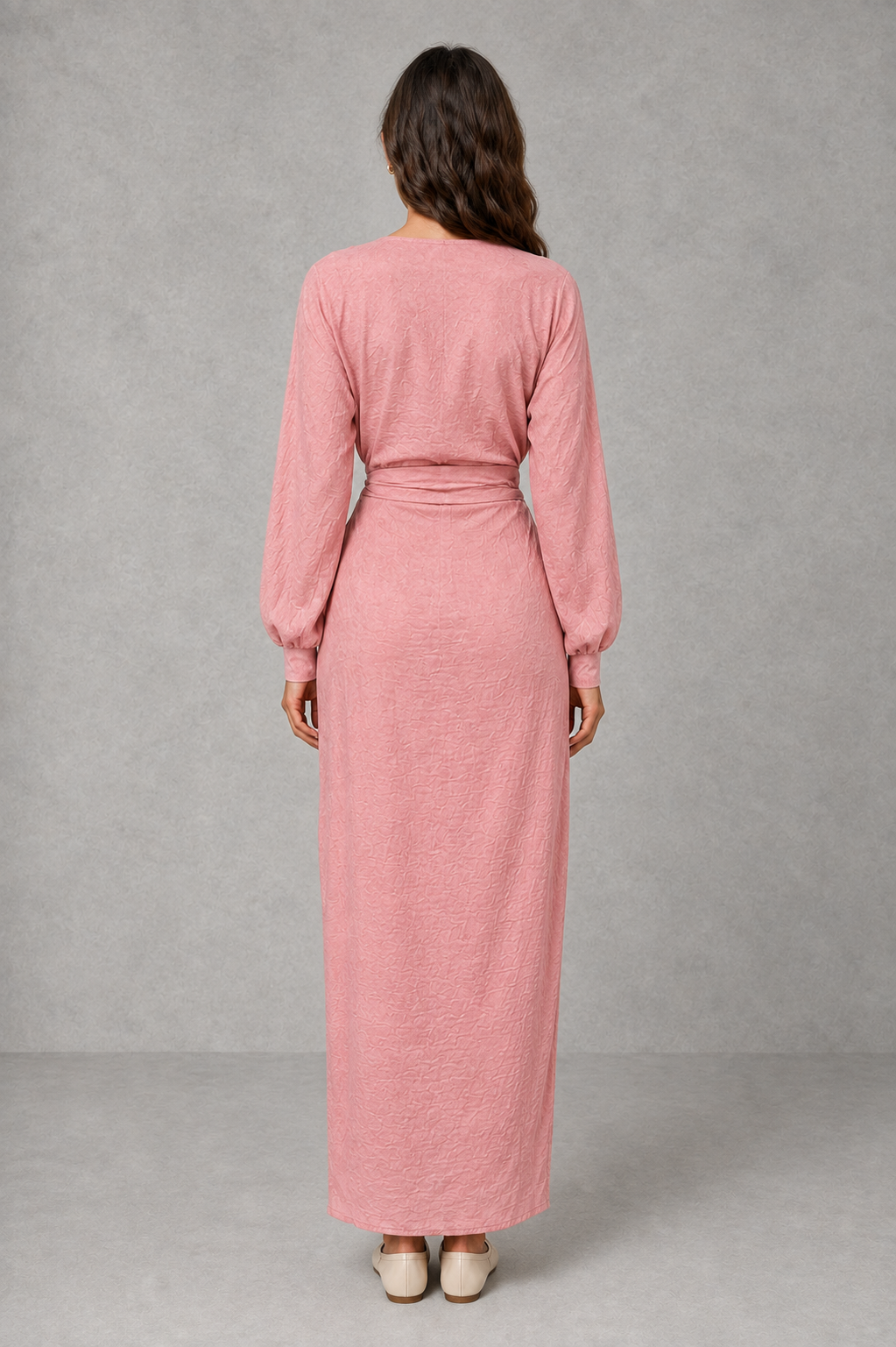 Women’s wrap maxi dress with a V-neckline, ruched side waist, long cuffed sleeves, flowing full-length skirt and subtle side slit.