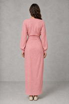 Women’s wrap maxi dress with a V-neckline, ruched side waist, long cuffed sleeves, flowing full-length skirt and subtle side slit.