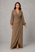 Women’s wrap maxi dress with a V-neckline, ruched side waist, long cuffed sleeves, flowing full-length skirt and subtle side slit.
