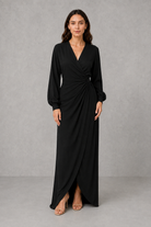 Women’s wrap maxi dress with a V-neckline, ruched side waist, long cuffed sleeves, flowing full-length skirt and subtle side slit.