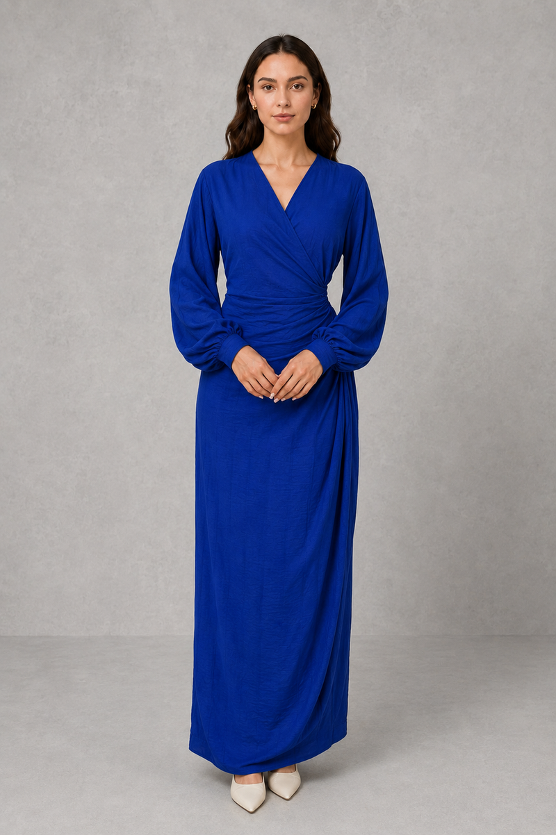 Women’s wrap maxi dress with a V-neckline, ruched side waist, long cuffed sleeves, flowing full-length skirt and subtle side slit.