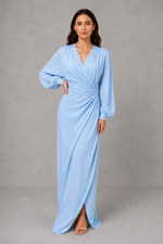 Women’s wrap maxi dress with a V-neckline, ruched side waist, long cuffed sleeves, flowing full-length skirt and subtle side slit.