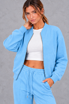 Women's zip-up jacket & trousers set in Light Blue – close-up view