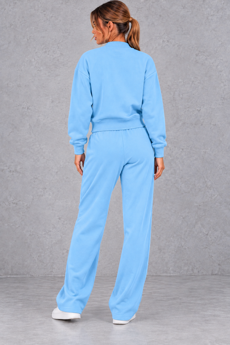 Women's zip-up jacket & trousers set in Light Blue – back view