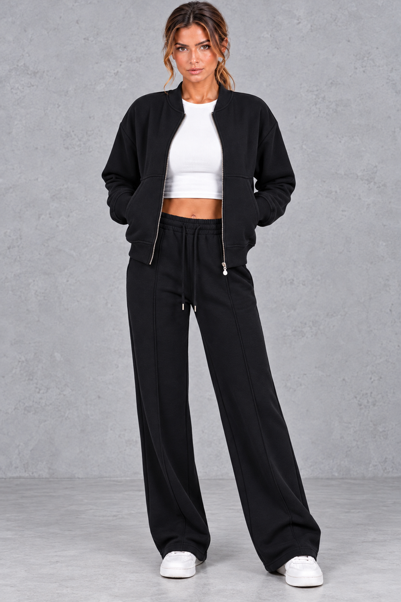 Women's zip-up jacket & trousers set in Black – front view