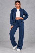Women's zip-up jacket & trousers set in Navy – front view