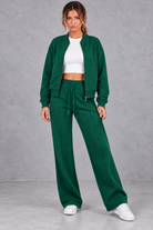 Women's zip-up jacket & trousers set in Green – front view
