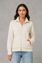 Women’s zip up knit cardigan with a cosy funnel neck, relaxed fit, long sleeves, ribbed trims and practical front patch pockets.