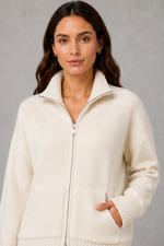 Women’s zip up knit cardigan with a cosy funnel neck, relaxed fit, long sleeves, ribbed trims and practical front patch pockets.