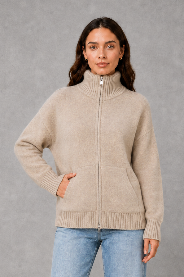 Women’s zip up knit cardigan with a cosy funnel neck, relaxed fit, long sleeves, ribbed trims and practical front patch pockets.