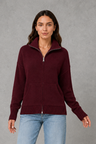Women’s zip up knit cardigan with a cosy funnel neck, relaxed fit, long sleeves, ribbed trims and practical front patch pockets.