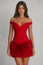 Red off-shoulder dress with floral details on a gray background