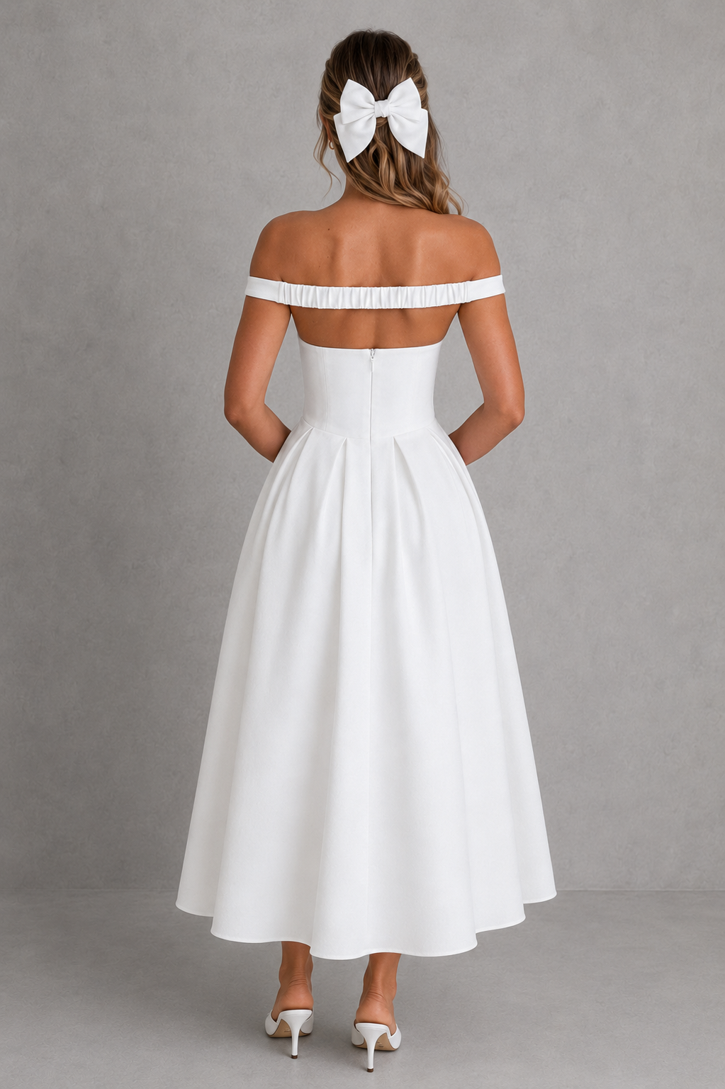 Woman wearing a white off-shoulder dress with a plain background