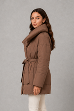 Women’s belted puffer jacket with a quilted design, adjustable waist belt, long sleeves and full front zip fastening.