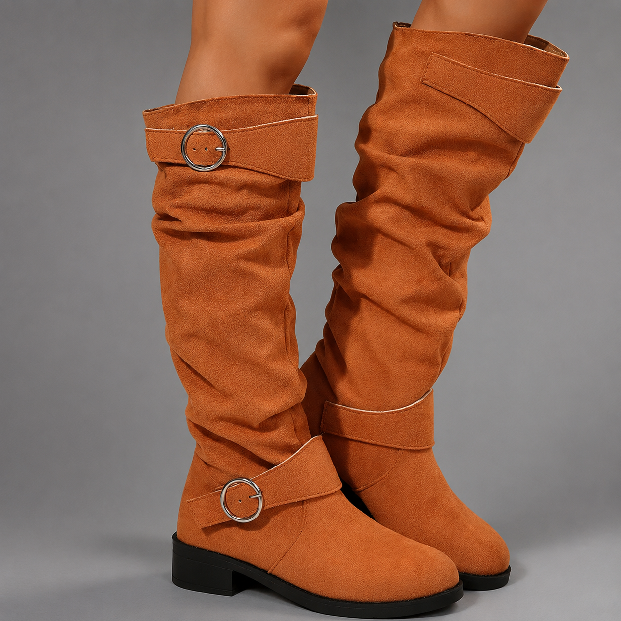 Women's black mid-calf slouch boots with decorative buckle accents, soft synthetic upper, slip-on design and durable rubber sole, styled for everyday casual wear.