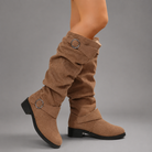 Women's black mid-calf slouch boots with decorative buckle accents, soft synthetic upper, slip-on design and durable rubber sole, styled for everyday casual wear.