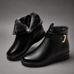 Women's black leather comfort ankle boots with a premium leather upper, soft shearling lining, decorative buckle detail, durable rubber sole and supportive ankle-high design, ideal for everyday autumn and winter wear.