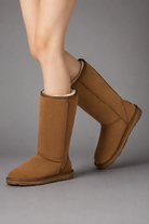Women's bow detail mid-calf snow boots with a soft faux fur upper, warm fleece lining, slip-on design, flat heel, cushioned plush insole and non-slip rubber sole, available in beige, brown, grey and black for cosy everyday winter wear.