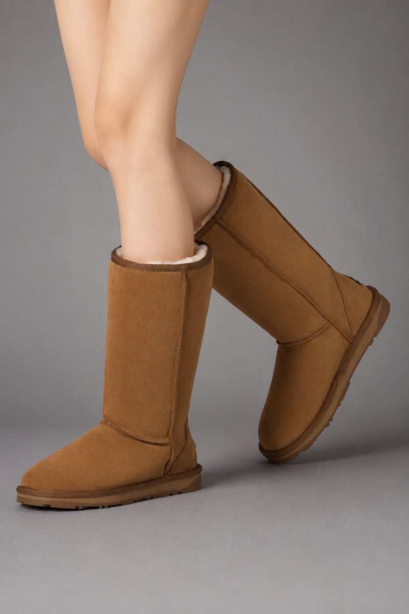 Women's bow detail mid-calf snow boots with a soft faux fur upper, warm fleece lining, slip-on design, flat heel, cushioned plush insole and non-slip rubber sole, available in beige, brown, grey and black for cosy everyday winter wear.