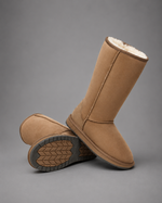 Women's bow detail mid-calf snow boots with a soft faux fur upper, warm fleece lining, slip-on design, flat heel, cushioned plush insole and non-slip rubber sole, available in beige, brown, grey and black for cosy everyday winter wear.
