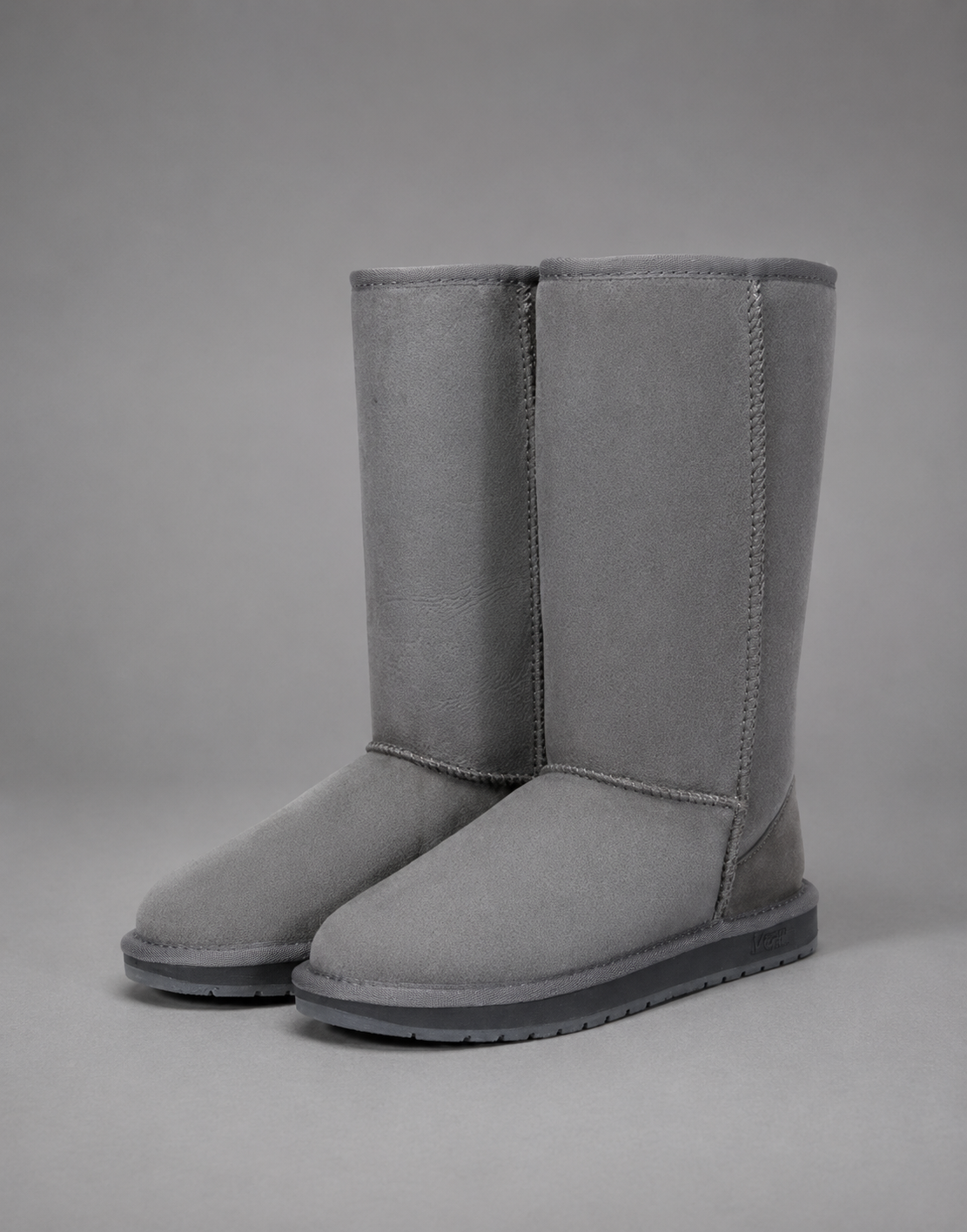 Women's bow detail mid-calf snow boots with a soft faux fur upper, warm fleece lining, slip-on design, flat heel, cushioned plush insole and non-slip rubber sole, available in beige, brown, grey and black for cosy everyday winter wear.