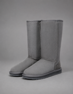 Women's bow detail mid-calf snow boots with a soft faux fur upper, warm fleece lining, slip-on design, flat heel, cushioned plush insole and non-slip rubber sole, available in beige, brown, grey and black for cosy everyday winter wear.