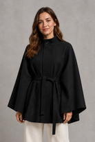Women's elegant wool-blend cape sleeve coat with stand collar, slim tailored fit and belted waist, ideal for autumn and winter formal wear.