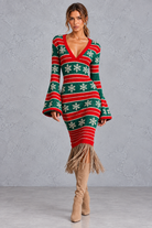 Women's red & green Fair Isle Christmas jumper dress with snowflakes and fringe hem – front view