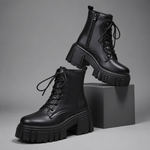 Women's black chunky sole combat boots with lace-up fastening, ankle-height design, round toe, medium square heel and durable rubber sole for casual everyday wear.