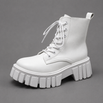 Women's black chunky sole combat boots with lace-up fastening, ankle-height design, round toe, medium square heel and durable rubber sole for casual everyday wear.