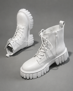 Women's black chunky sole combat boots with lace-up fastening, ankle-height design, round toe, medium square heel and durable rubber sole for casual everyday wear.
