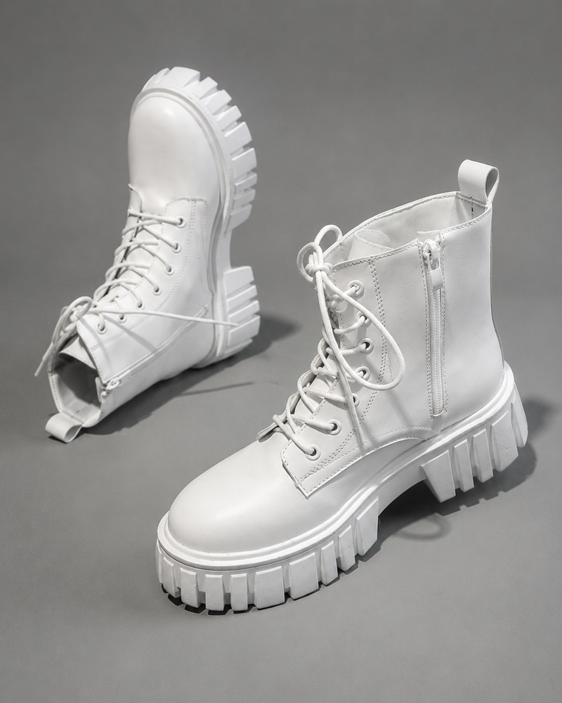 Women's black chunky sole combat boots with lace-up fastening, ankle-height design, round toe, medium square heel and durable rubber sole for casual everyday wear.