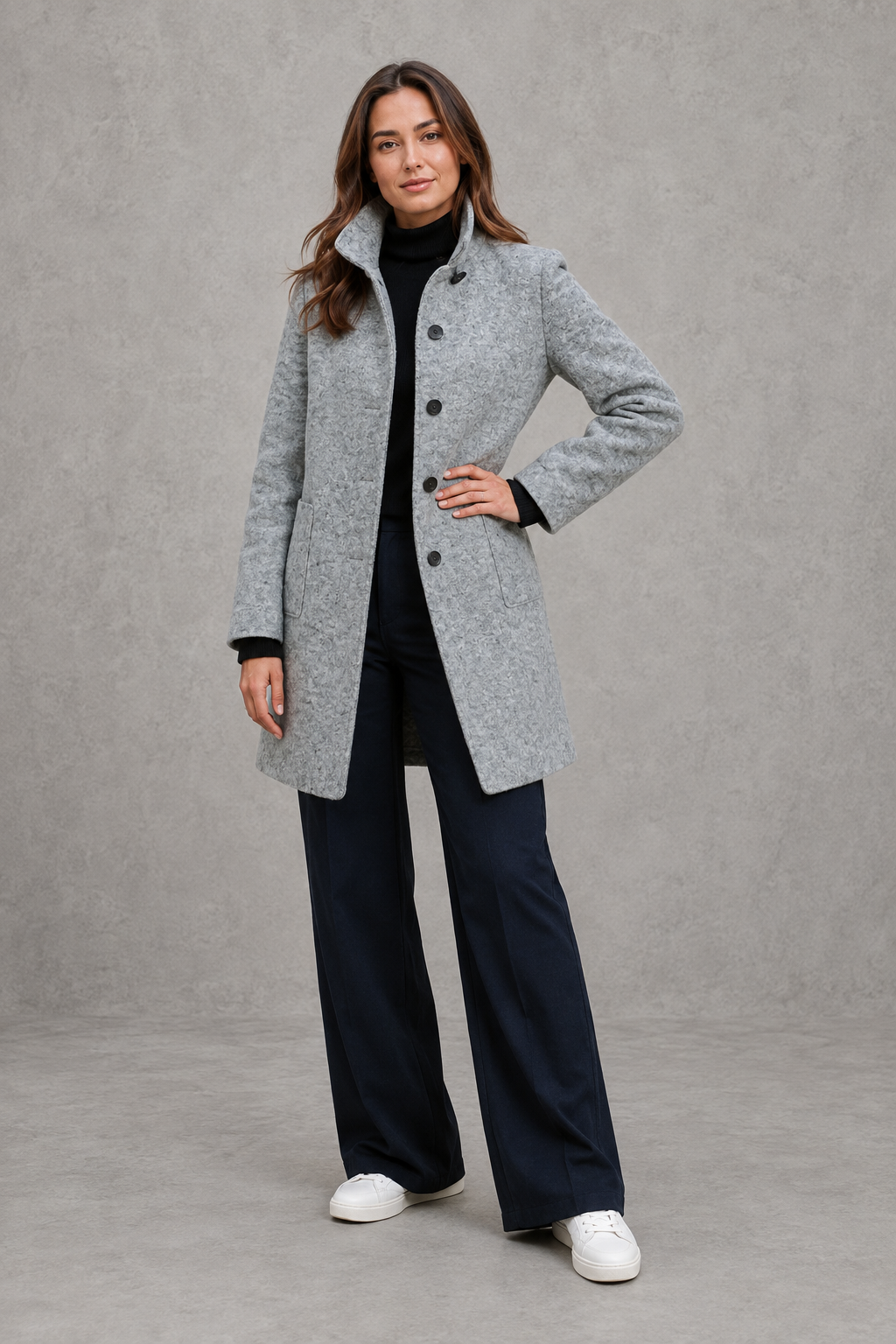 Women's classic longline winter coat with a tailored straight fit, button-front fastening, side pockets and elegant lapel collar, designed for warm, timeless autumn and winter styling.