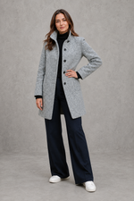 Women's classic longline winter coat with a tailored straight fit, button-front fastening, side pockets and elegant lapel collar, designed for warm, timeless autumn and winter styling.