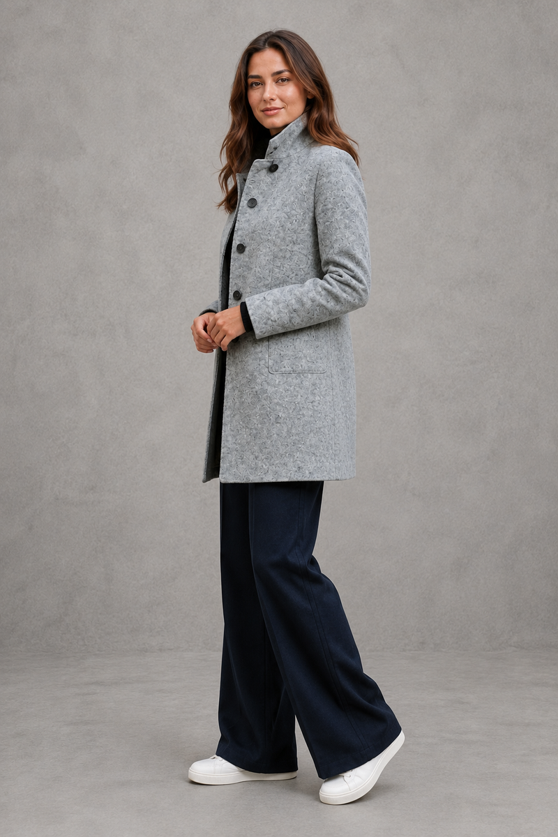 Women's classic longline winter coat with a tailored straight fit, button-front fastening, side pockets and elegant lapel collar, designed for warm, timeless autumn and winter styling.
