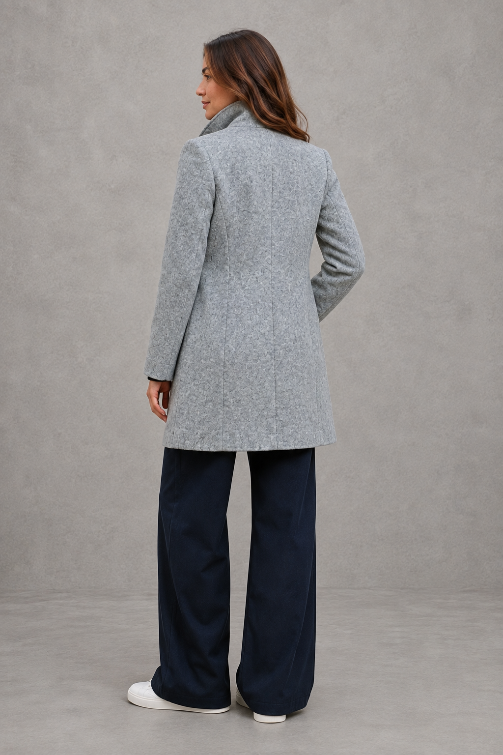 Women's classic longline winter coat with a tailored straight fit, button-front fastening, side pockets and elegant lapel collar, designed for warm, timeless autumn and winter styling.