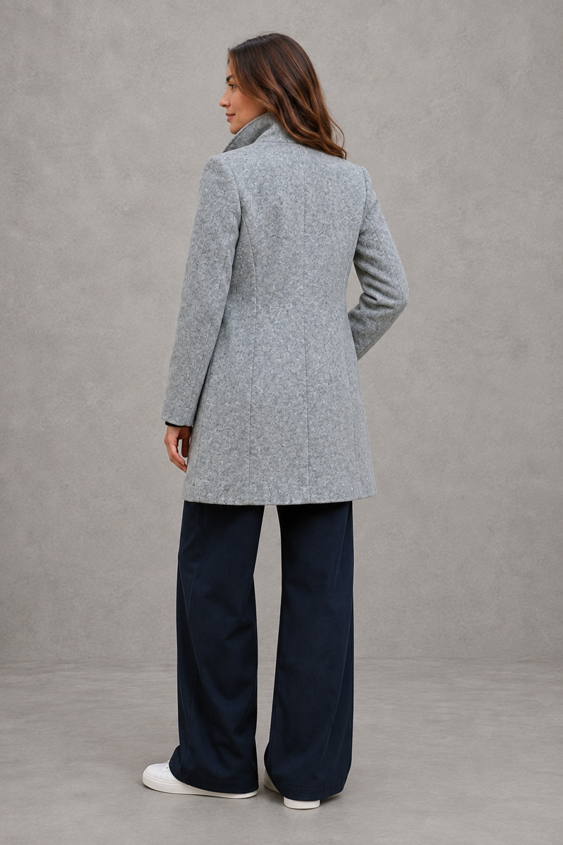 Women's classic longline winter coat with a tailored straight fit, button-front fastening, side pockets and elegant lapel collar, designed for warm, timeless autumn and winter styling.